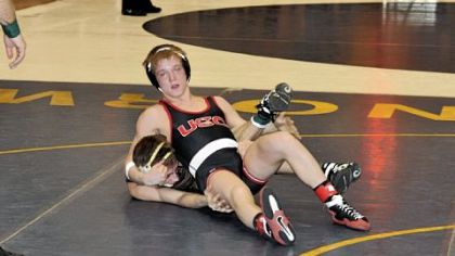 Montour's Anthony Marks
goes against Plum's John Marotto in the 138-pound semifinals at the Allegheny
County tournament.