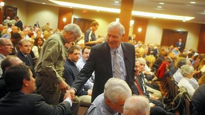 Penn State University president Rodney Erickson greets attendees Wednesday night before the town hall meeting with alumni about the administration's handling of the Jerry Sandusky child sex-abuse scandal.
