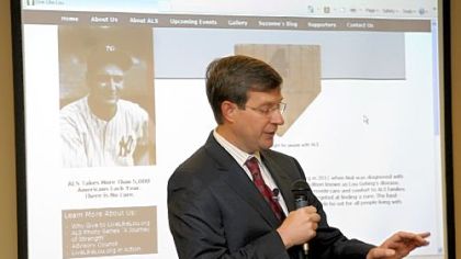 Neil Alexander, 46, recently diagnosed with Lou Gehrig's disease, speaks at The Pittsburgh Foundation about the loss of movement in his left hand.