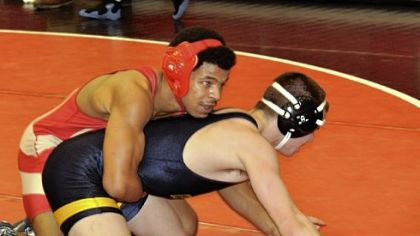 Penn Hills High School's Joseph Washington, top, goes against Central Catholic's Tony Palumbo in a 145-pound
semifinal match at the Allegheny County Tournament.