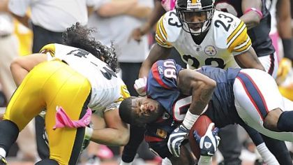 Photographer Peter Diana earned an award of excellence in the Society of Newspaper Design international competition for a picture of Troy Polamalu menacing the competition during a Steelers game.