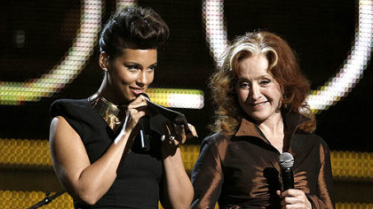 Alicia Keys, left, and Bonnie Raitt, present the award for best pop solo performance during the 54th annual Grammy Awards on Sunday.
