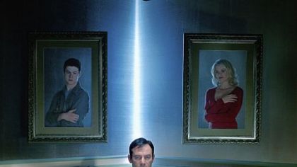 In the new series "Awake," Jason Isaacs, center, stars as a police detective living out what seems to be two realities: one in which his son, portrayed by Dylan Minnette, has died and the other, in which his wife, played by Laura Allen, has died.