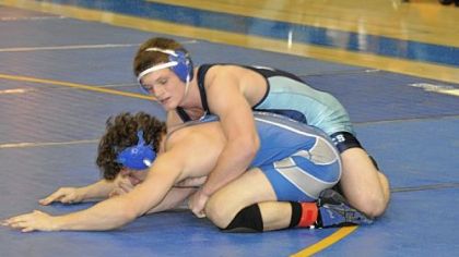 Burrell's Dakota DesLauriers (top), wrestling against Hempfield Area's Kyle Spangler in the 182-pound title match at the Powerade Tournament on Dec. 30, registered a pin in the WPIAL team championship match to help the Bucs win their sixth title in a row.