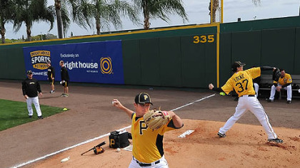 Gerrit Cole, left, at work in the bullpen this week, part of the slow, daily grind toward becoming the ballplayer he wants to be and that the Pirates envisioned when they selected him No. 1 overall out of UCLA in the June draft.