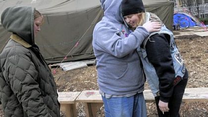 Matt Wheeler of the South Side, center, and Halley Katz of Bloomfield comfort each other while Tracie Doyle of McKeesport looks on Thursday at the Occupy Pittsburgh camp in Mellon Green, Downtown.