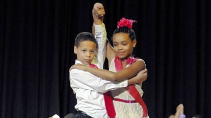 Darnell Bouie and Laela Lumsden, students at Sister Thea Bowman Catholic Academy, tango in a team dance competition at Pittsburgh Allderdice High School on Saturday.