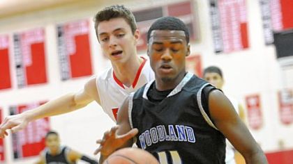 Woodland Hills' D.J. Kyles fights for the ball Tuesday with Fox Chapel's Matt D'Amico.