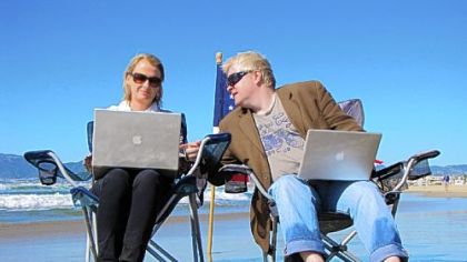"FrackNation" creators Ann McElhinney and Phelim McAleer sitting on the beach at Marina del Rey in greater Los Angeles.