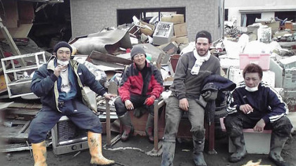 Matthew Ketchum of Mt. Lebanon, second from right, rests with friends during cleanup in the fishing port of Miyako, Japan, after the earthquake and tsunami March 11.
