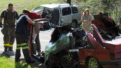 Crews during cleanup at the crash that killed three Friday morning in Smith, Washington County.
