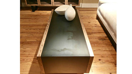 Maria Yee's hot rolled steel coffee table framed in Nordic pine.