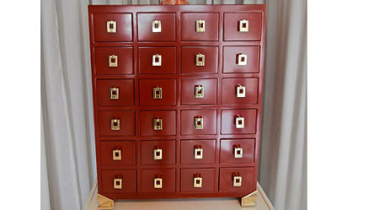 Lexington Home Brands used red lacquer and brass hardware in its Aquarius collection, featuring this Asia-inspired chest.