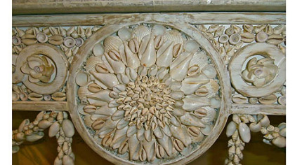 Detail of the apron of a shell console by Currey & Co.