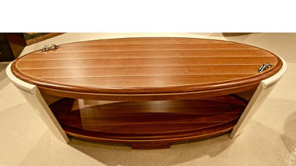 Theodore Alexander Yacht Cocktail table - nautical inspired complete with 
steel cleats curved bow and stern.