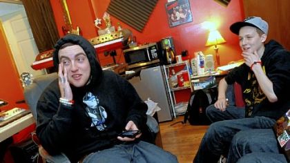 Rapper Mac Miller, left, and Bobby Stewart of Fox Chapel select tracks at I.D. Labs in Lawrenceville. Bobby, who has T-cell lymphoma, wished to write and record a rap song with Miller.