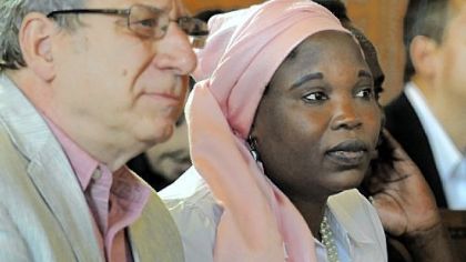 PDEC Coordinator David Rosenberg sits with Hawa  Abdullah, and activist and aid worker who was arrested and tortured by the Sudanese government before an international effort led to her release.