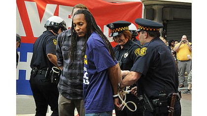 Some of the eleven people, from a crowd of more than 200, being  arrested in Downtown Pittsburgh Wednesday.