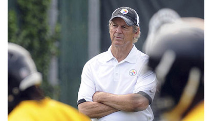 Defensive coordinator Dick LeBeau keeps an eye on the secondary players as they practice this morning.