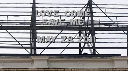 A message on the billboard above the Waffle Shop read "LOVE COME SAVE ME, MAY 28 2011" on a recent day this month.
