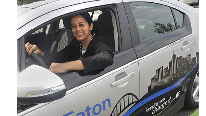 Revathi Advaithi, president of Eaton's entire North and South American region for Eaton's electrical sector based in Moon, sits in a Chevy Volt that is plugged in at an Eaton charging station in Moon.