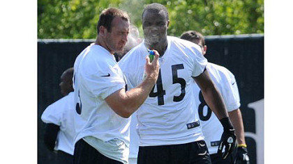 Steelers tight ends Heath Miller and Leonard Pope spray their faces  start of practice.