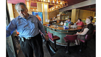 John Petrolias reflects on his closed Smithfield Cafe, a business started by his father in Downtown. Mr. Petrolias and his longtime workers are winding down the business after closing the doors to customers last Friday.