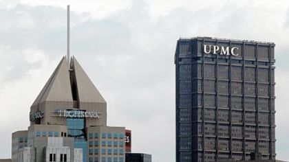On Pittsburgh's downtown skyline, the headquarters of Highmark in view with the U.S. Steel Tower offices of UPMC. Gov. Tom Corbett says he wants the two health care giants to continue to work on a longer-term deal.