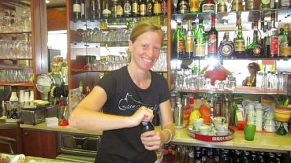 Simona serves beverages at Bar Arcobaleno in Quercianella.