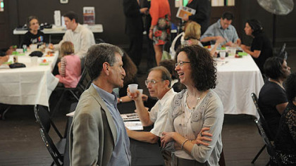 Robert Ruck, left, talks with Catherine Stephens, both of Squirrel Hill, at the tenth anniversary celebration of the Young Preservationists Association of  Pittsburgh on Saturday.