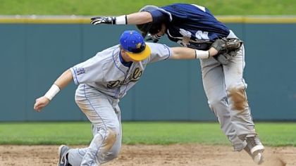 Mt. Lebanon's Ian Happ tags out McDowell's Alex Margraf at second base Monday in the first round of the PIAA playoffs.