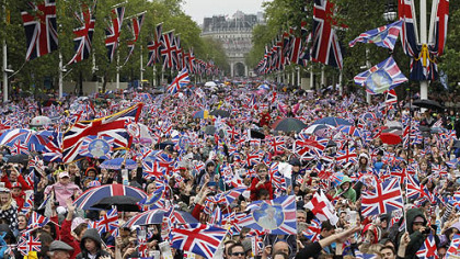 Revelers crowd the Mall in London Tuesday, seeking a glimpse of Queen Elizabeth II on the Buckingham Palace balcony as part of a four-day Diamond Jubilee celebration.