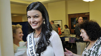 Sheena Monnin, Miss Pennsylvania USA, walks through the crowd in March at the 17th Annual Empty Bowls Dinner at Rodef Shalom Congregation. Ms. Monnin resigned from her position Monday.