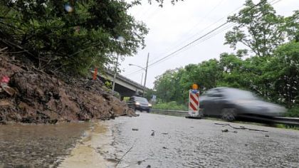 A landslide has restricted a portion of Clever Road to an alternating single-lane pattern and a temporary traffic signal has been installed to control traffic.