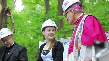 Bishop David A. Zubik, right, talks with Lillia Smyers, 14, of Ross, who will be starting ninth grade at North Catholic in the upcoming school year. The occasion is Saturday's groundbreaking for the new Cardinal Wuerl North Catholic High School in Cranberry.
