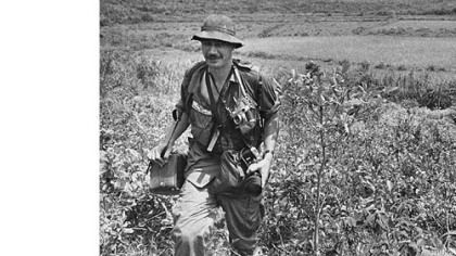 Eddie Adams covers action in South Vietnam in 1965 for The Associated Press.