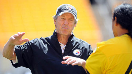 Steelers defensive coordinator Dick LeBeau talks with Troy Polamalu during organized team activities Thursday at Heinz Field.