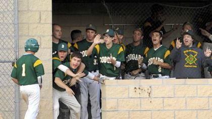 The Blackhawk players in the dugout celebrate the run scored by Zach Hildebrand, far left, Thursday against Thomas Jefferson at North Allegheny. Blackhawk won, 6-1.