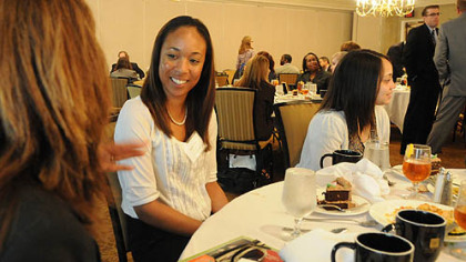 Brittany Kennedy of Morningside listens to Rochele Cantini, left, a vice president with BNY Mellon Asset Management, during a job fair at the Rivers Club at Oxford Center. Brittany is a graduate of CAPA who recently has completed a degree in Visual Arts at Edinboro University.