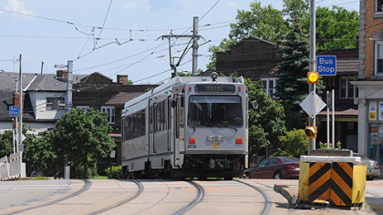 The Port Authority''s "T" light rail travels past the Coast Avenue stop in Beechview on Friday.