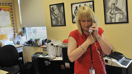 Faison principal LouAnn Zwieryznski recites the Pledge of Allegiance on May 30 during the school's morning announcements.