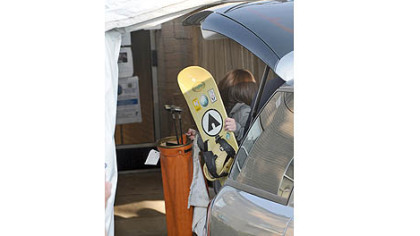 Prosecution evidence, including a snowboard and golf clubs, is unloaded Monday morning at the Centre County Courthouse for the beginning of testimony in the Jerry Sandusky trial.