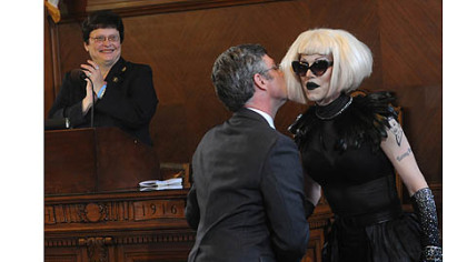 Pittsburgh city councilor Patrick Dowd congratulates drag queen Sharon Needles with a kiss after council declared June 12, 2012 Sharon Needles Day in Pittsburgh.