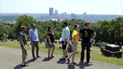 Stopping at St. John Lutheran Cemetery in Spring Hill as part of a tour of every city neighborhood are, from left, Nathan Mallory, Matt Barron, Lauren Stoner, Adam Shuck, Jennifer Grab and Alex Pazuchanics.