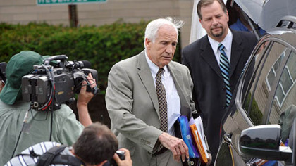 Jerry Sandusky leaves the Centre County Courthouse following the first day of testimony in his trial.