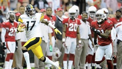 Mike Wallace streaks to a 95-yard touchdown last season against Arizona.