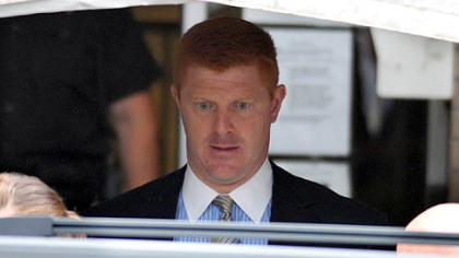 Mike McQueary, a Penn State assistant football coach who is currently on leave, exits the Centre County Courthouse on Tuesday after testifying for two hours.