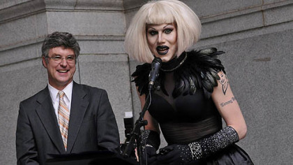 After having a proclamation read in city council proclaiming June 12, 2012, as Sharon Needles Day in Pittsburgh, Ms. Needles speaks on the portico of the City-County Building before performing for her fans. At left is Councilman Patrick Dowd, who sponsored the proclamation.