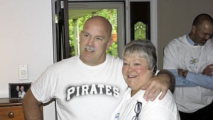 Jon Gracey stands with Jane Fenner Tuesday. She played a big part in securing the trip to  Pittsburgh so he and his three children can watch the Pirates play Detroit next weekend.