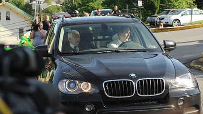 Former Penn State University assistant football coach Jerry Sandusky and his attorney Joe Amendola arrive for the fourth day of Sandusky's trial.